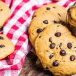 chocolate chip cookies on a re chequed tablecloth