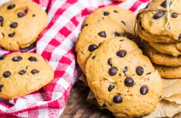 chocolate chip cookies on a re chequed tablecloth