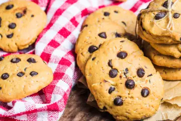 chocolate chip cookies on a re chequed tablecloth