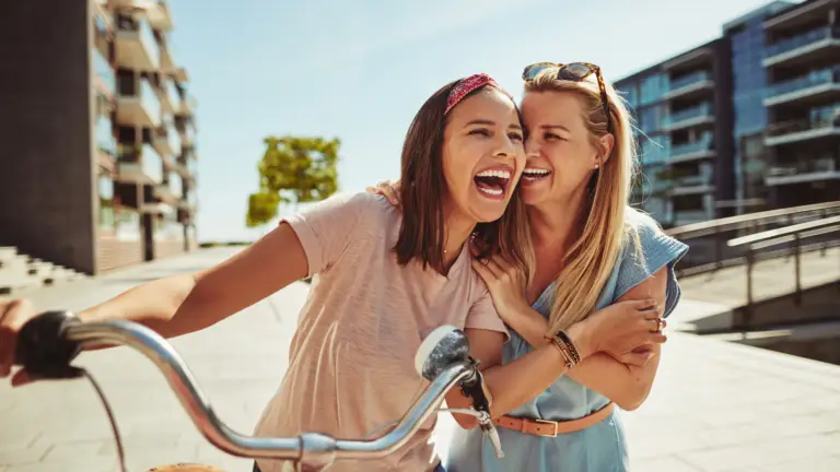 2 women laughing