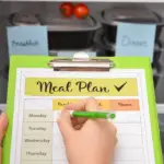 meal plan checklist infront of a stocked fridge